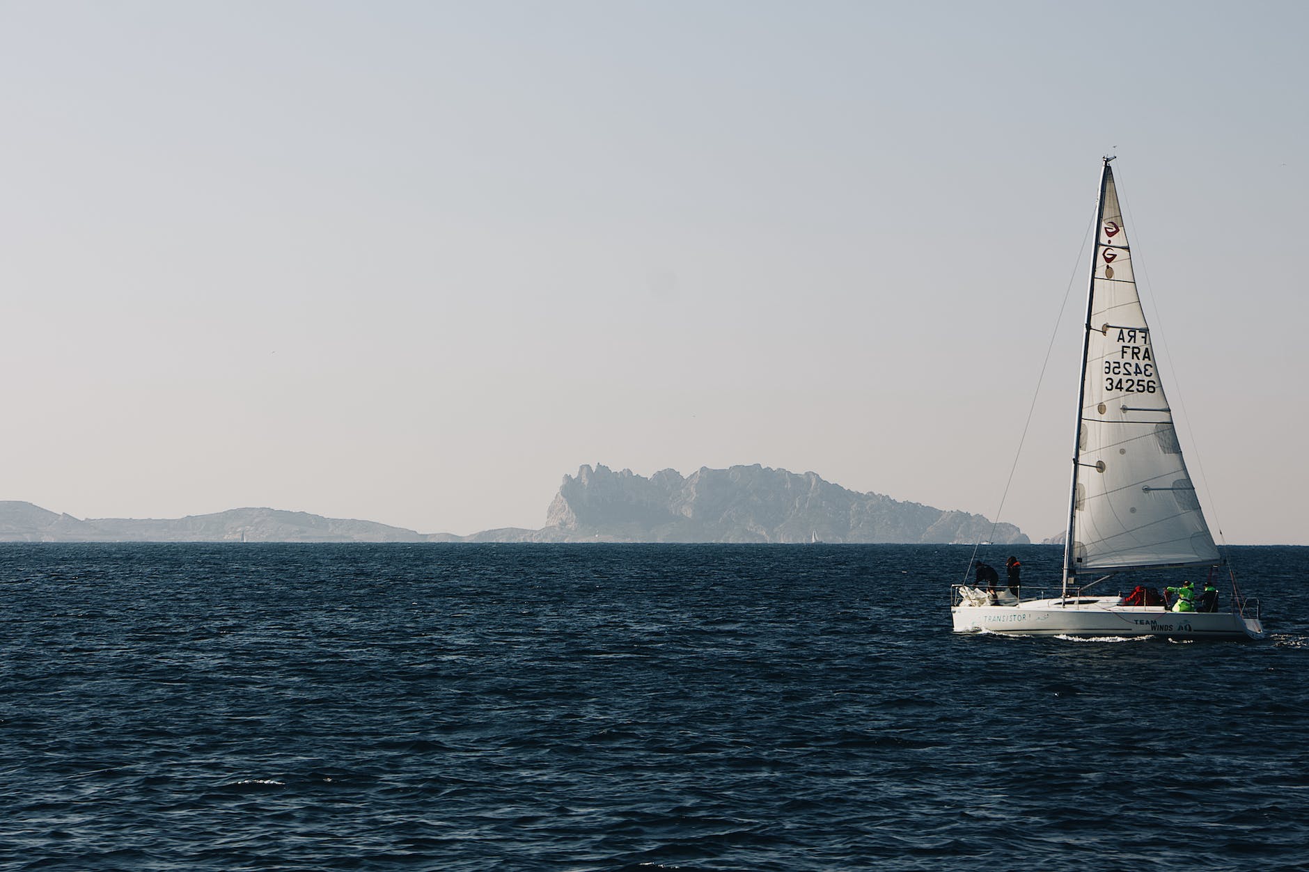 photo of sail boat on ocean